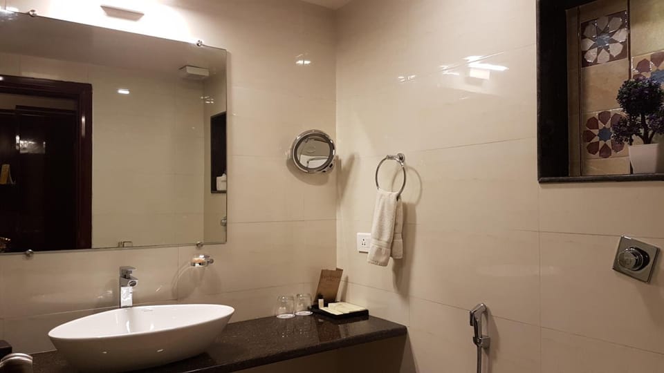 Shower, hair dryer, slippers, towels