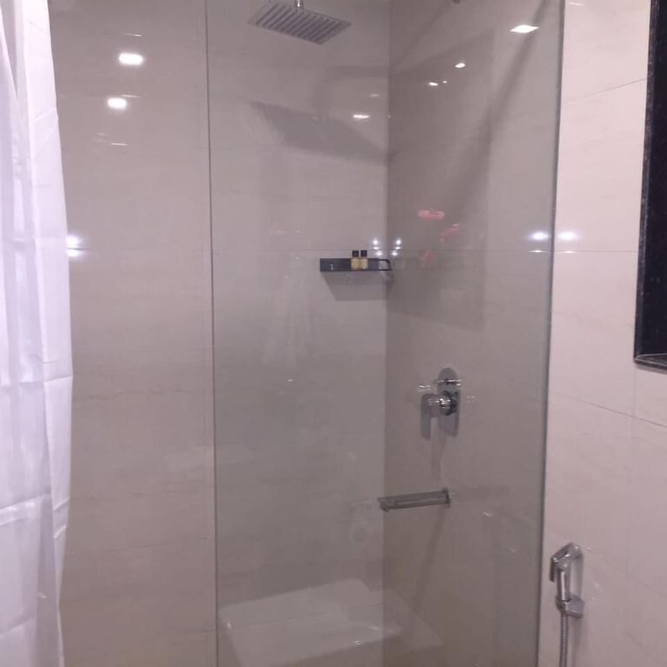 Shower, hair dryer, slippers, towels