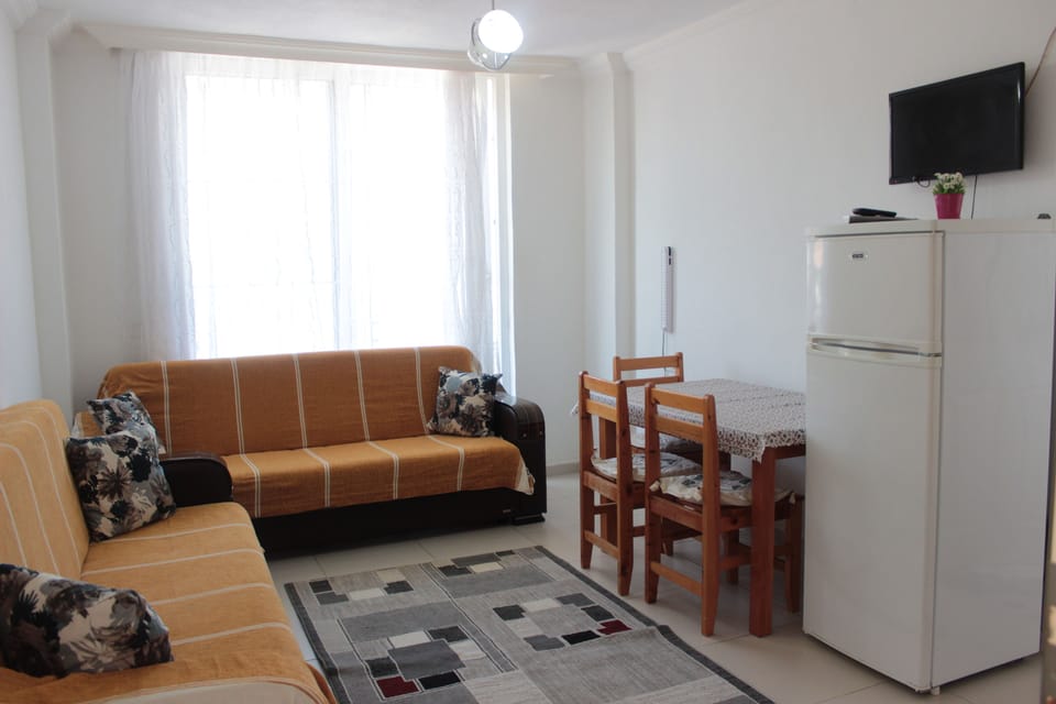 Standard Apartment | Living area | 27-inch LED TV with premium channels, TV