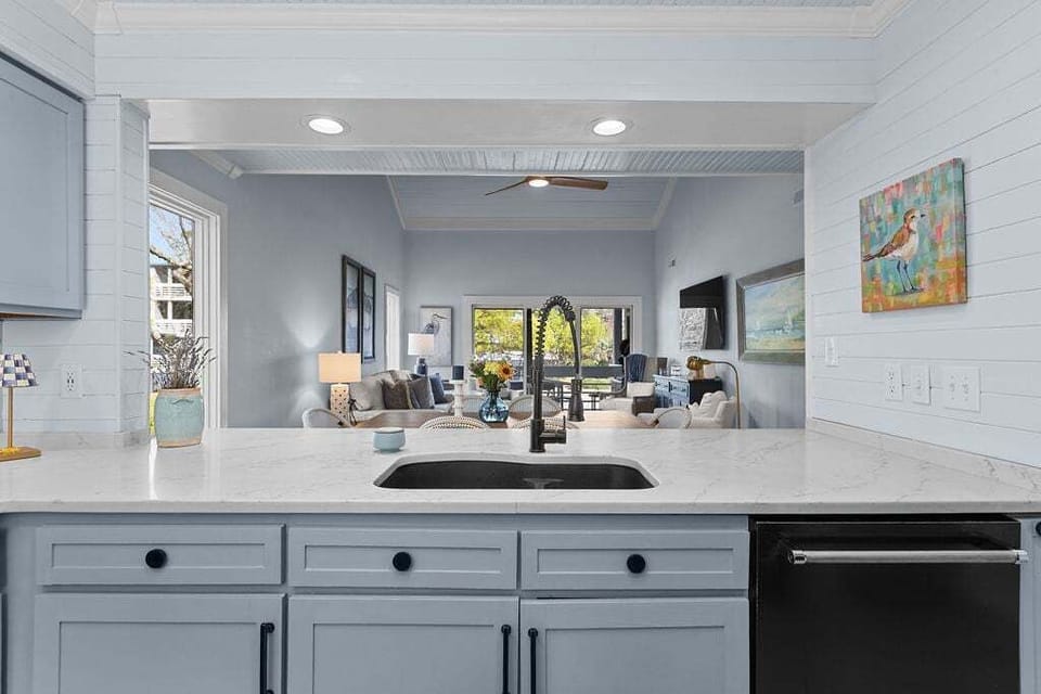 Kitchen counter opens up to the living and dining areas