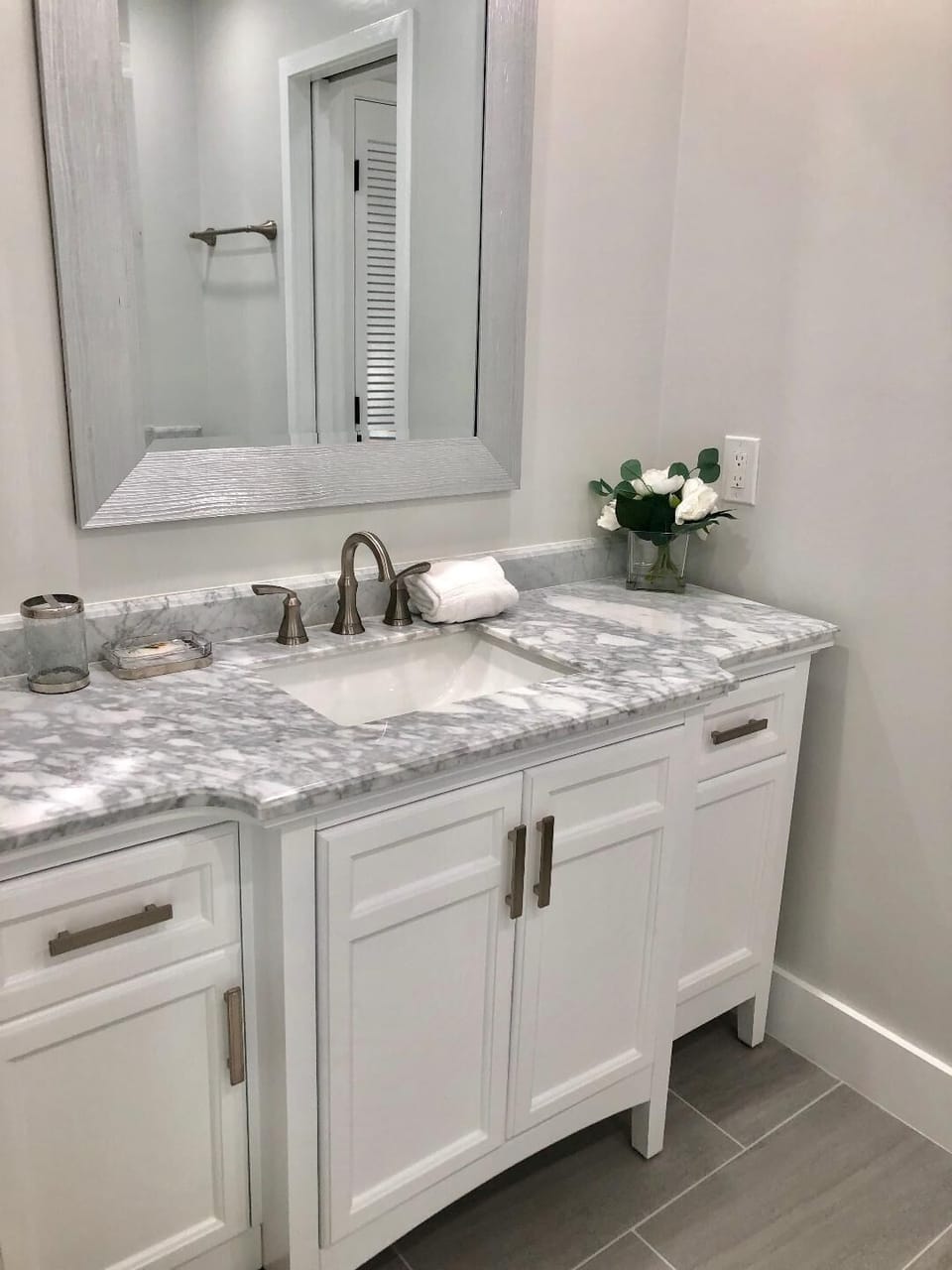 Marble counter tops on dual vanities in the master bathroom.