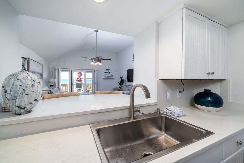 Pass through from the kitchen into the living area. Views of the ocean!