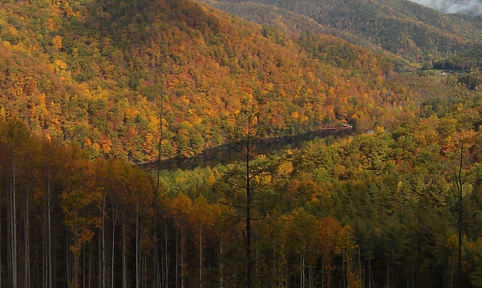 view of the lake from the mountains surrounding it