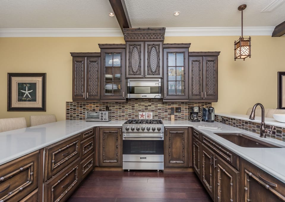 Fully equipped kitchen with stainless steel appliances and granite counter tops.