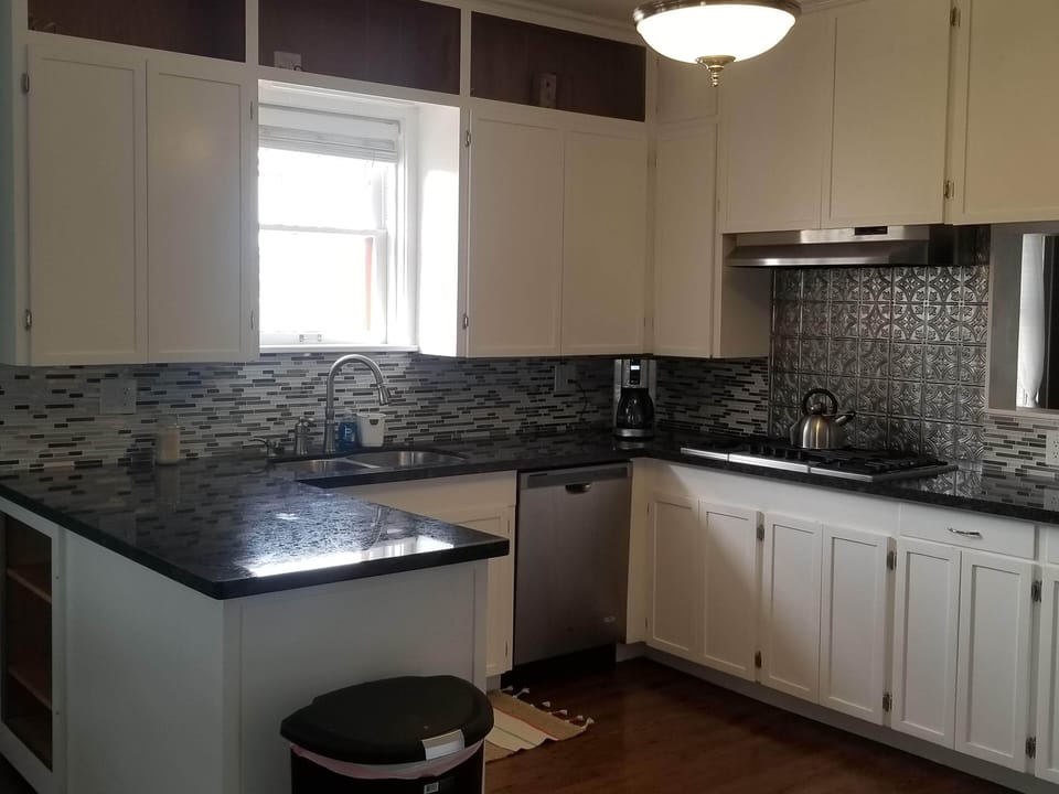 Upper level kitchen - Gas stove, dual oven, dishwasher and breakfast nook