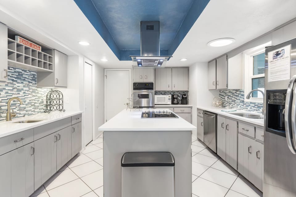 Fully equipped kitchen with stainless steel appliances.
