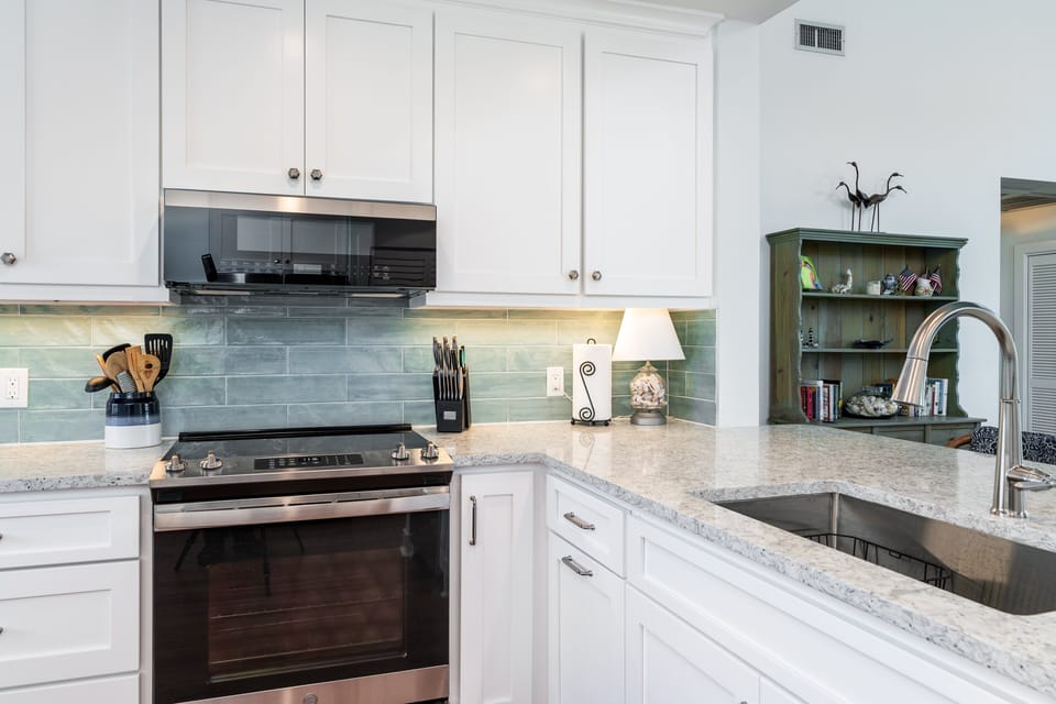 Custom cabinets, granite counters and stainless steel appliances are featured in the renovated kitchen!