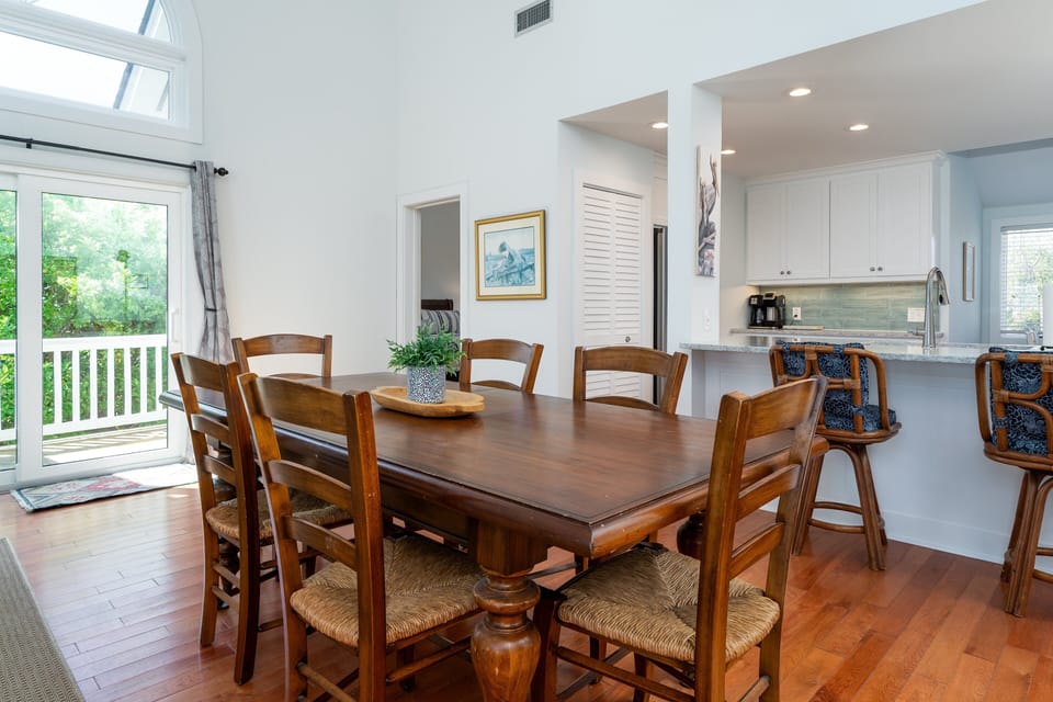 Sliding doors off dining area lead out to the side deck