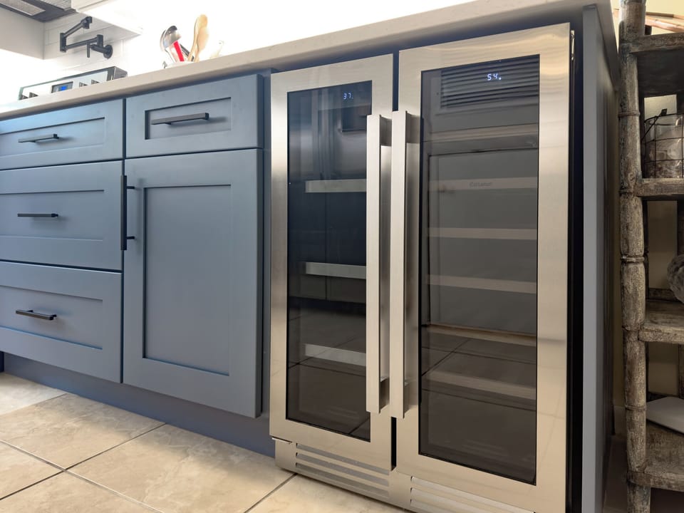 In the kitchen their is a wine fridge