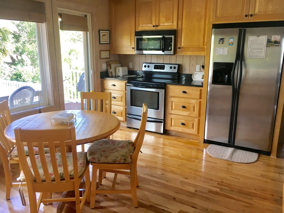 Step to the back deck with golf views to bbq and dine.