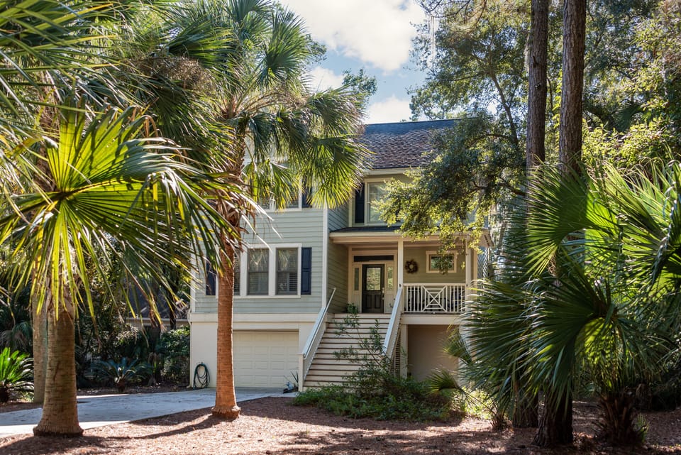 Welcome to this Charleston-style home with great views of Mallard Lake.