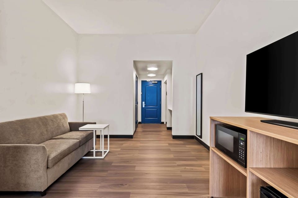 Room, 1 King Bed with Sofa bed | Premium bedding, laptop workspace, blackout drapes, iron/ironing board