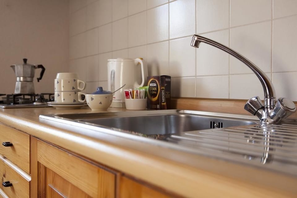 Comfort Apartment | Private kitchen | Full-size fridge, electric kettle, freezer