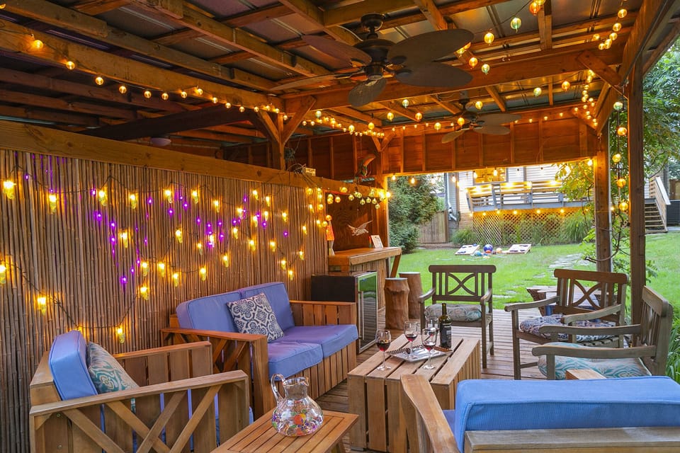 The enchanting barzebo in the fully-fenced backyard feels magical.