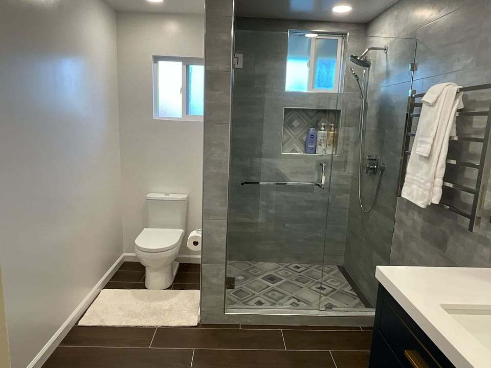 Newly renovated bathrooms on the second floor with towel warmer 