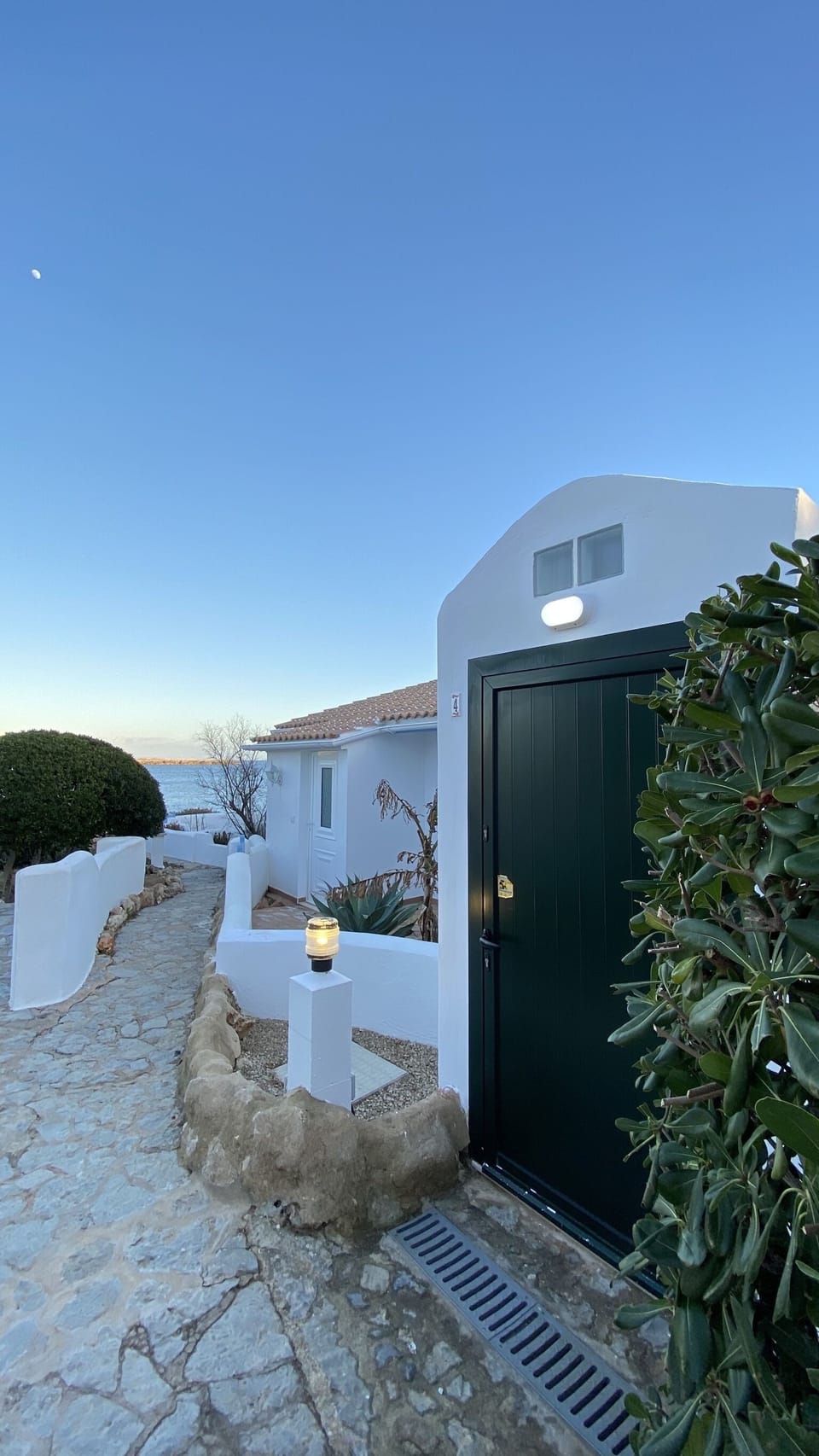 outside main entrance to property view at sunset 