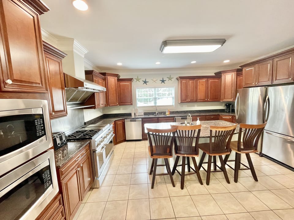 Gas range, 2 ovens, 2 refrigerators, 2 dishwashers, 2 microwaves, 2 sinks