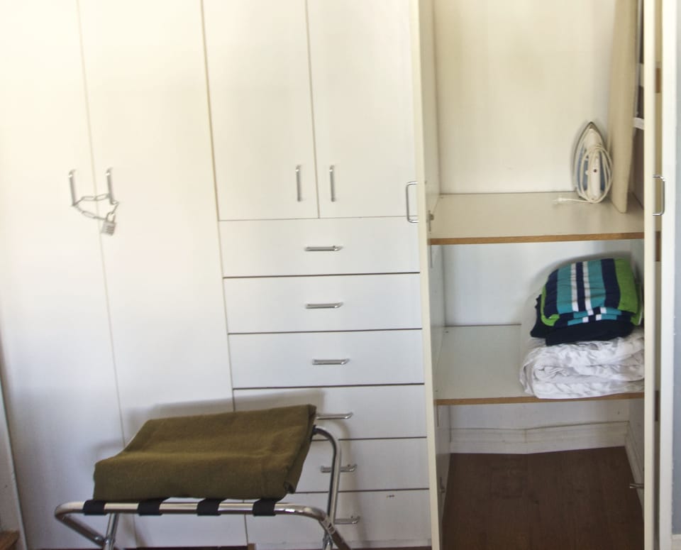 Big closet, iron and iron board, extra blankets and towels, suitcase stand.