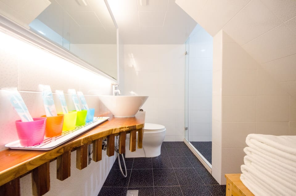 Family Room (Sailor) | Bathroom | Shower, hair dryer, slippers, towels