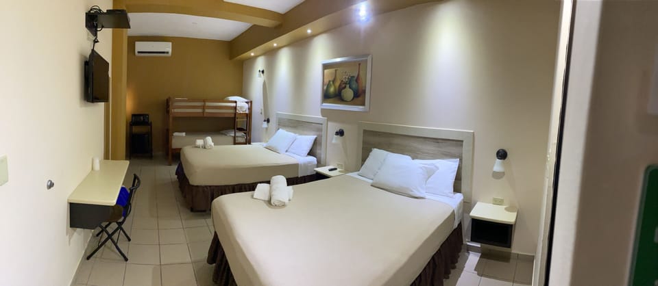 Family Room, Multiple Beds | Desk, soundproofing, free WiFi, bed sheets