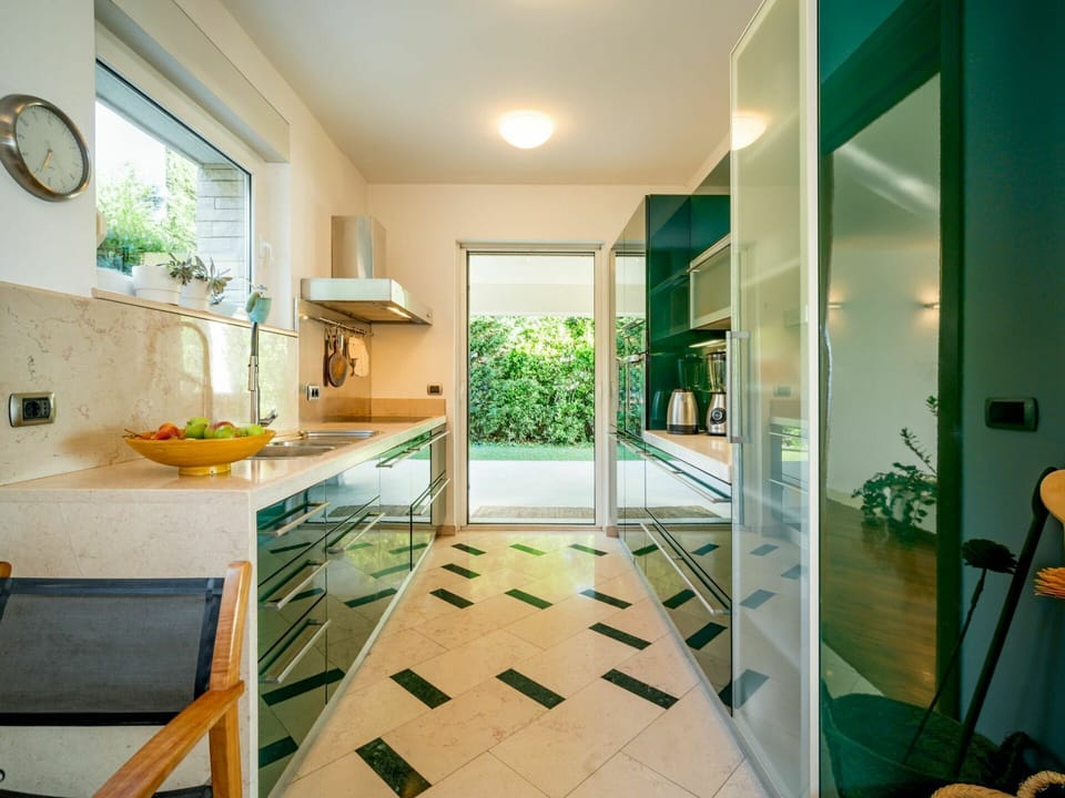Green, Plant, Building, Interior Design, Architecture, Window, Cabinetry, Yellow, Wood, Clock