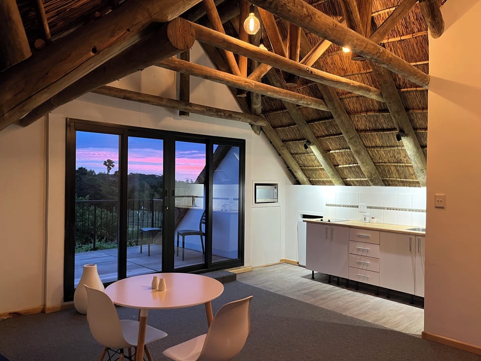 Superior Studio Suite | Living area | Flat-screen TV, Netflix, DVD player, iPod dock