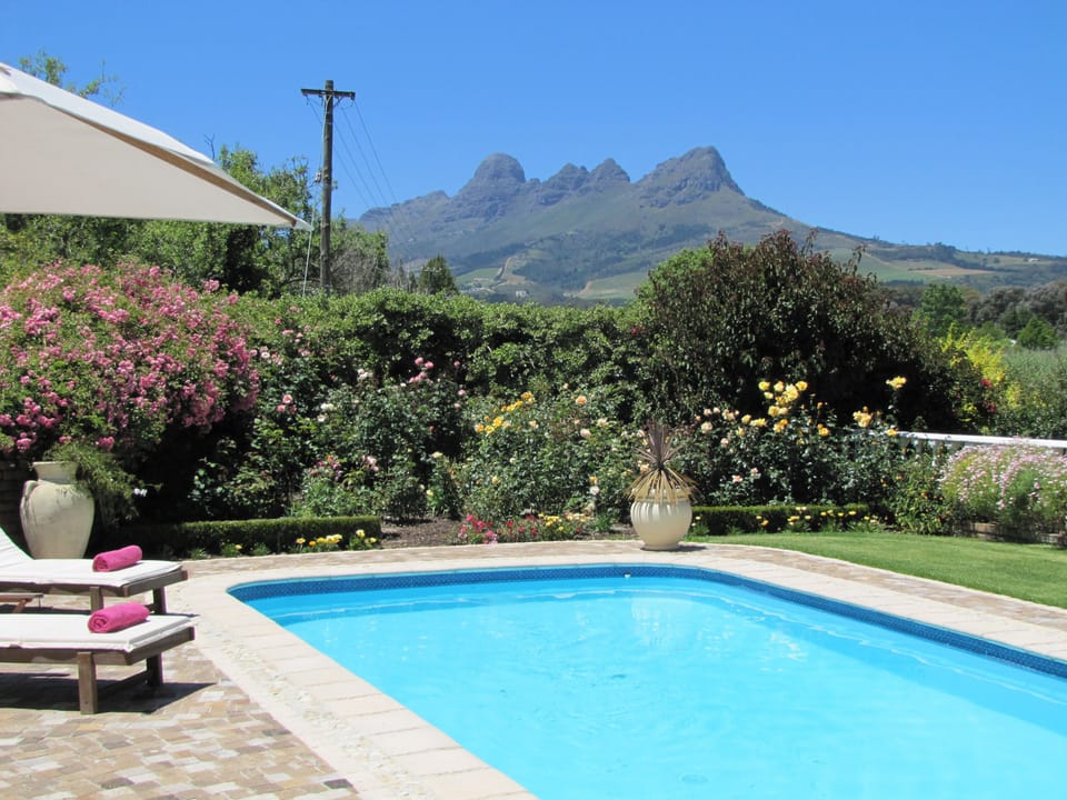 Lavender Cottage | Pool | Outdoor pool, pool umbrellas, sun loungers
