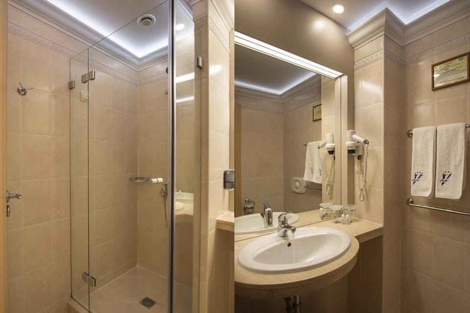 Bathroom | Shower, free toiletries, hair dryer, slippers
