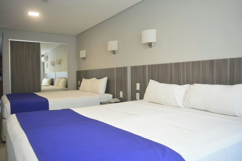Premium bedding, down comforters, in-room safe, desk