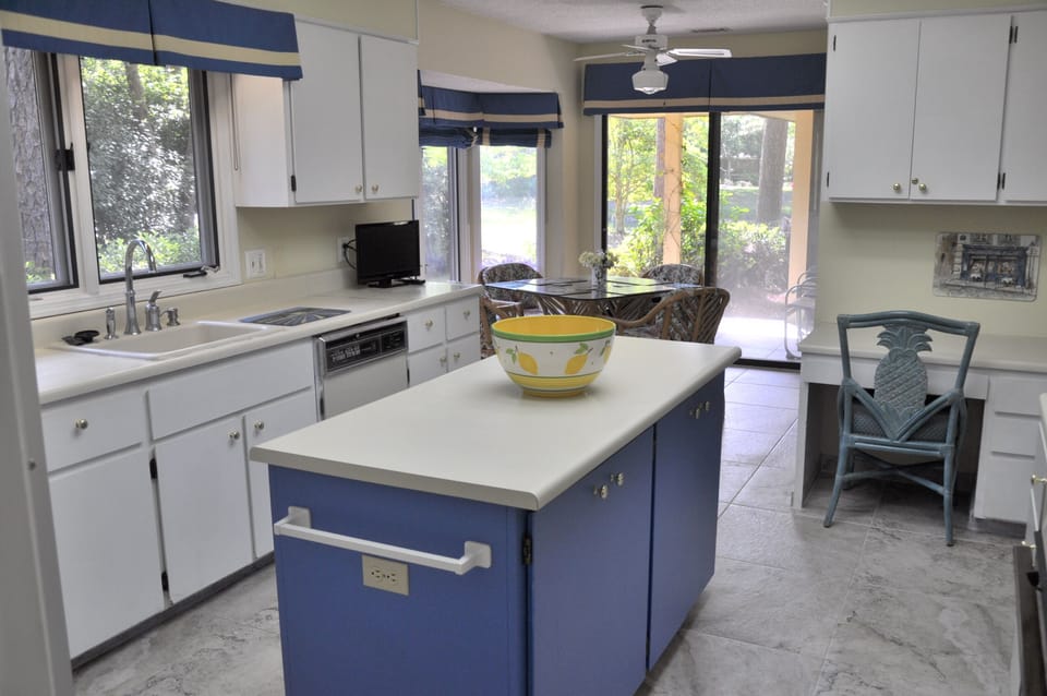 Generous cupboard and counter space, many windows, easy to work in.