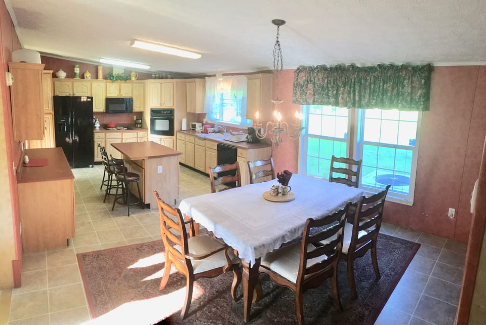 Large eat-in kitchen with breakfast bar and dining room