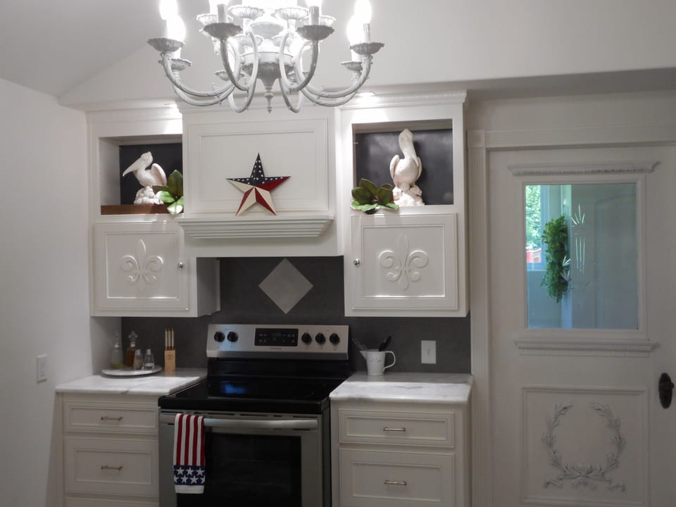 Back wall-full-sized kitchen. Antique door leads to laundry room-Seasonal Decor