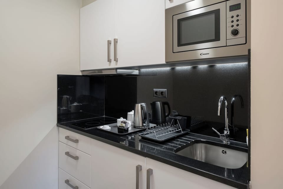 Garden Apartment 1 | Private kitchen | Microwave, stovetop, coffee/tea maker, electric kettle