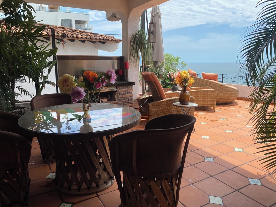 Outdoor grill and outdoor dining table.