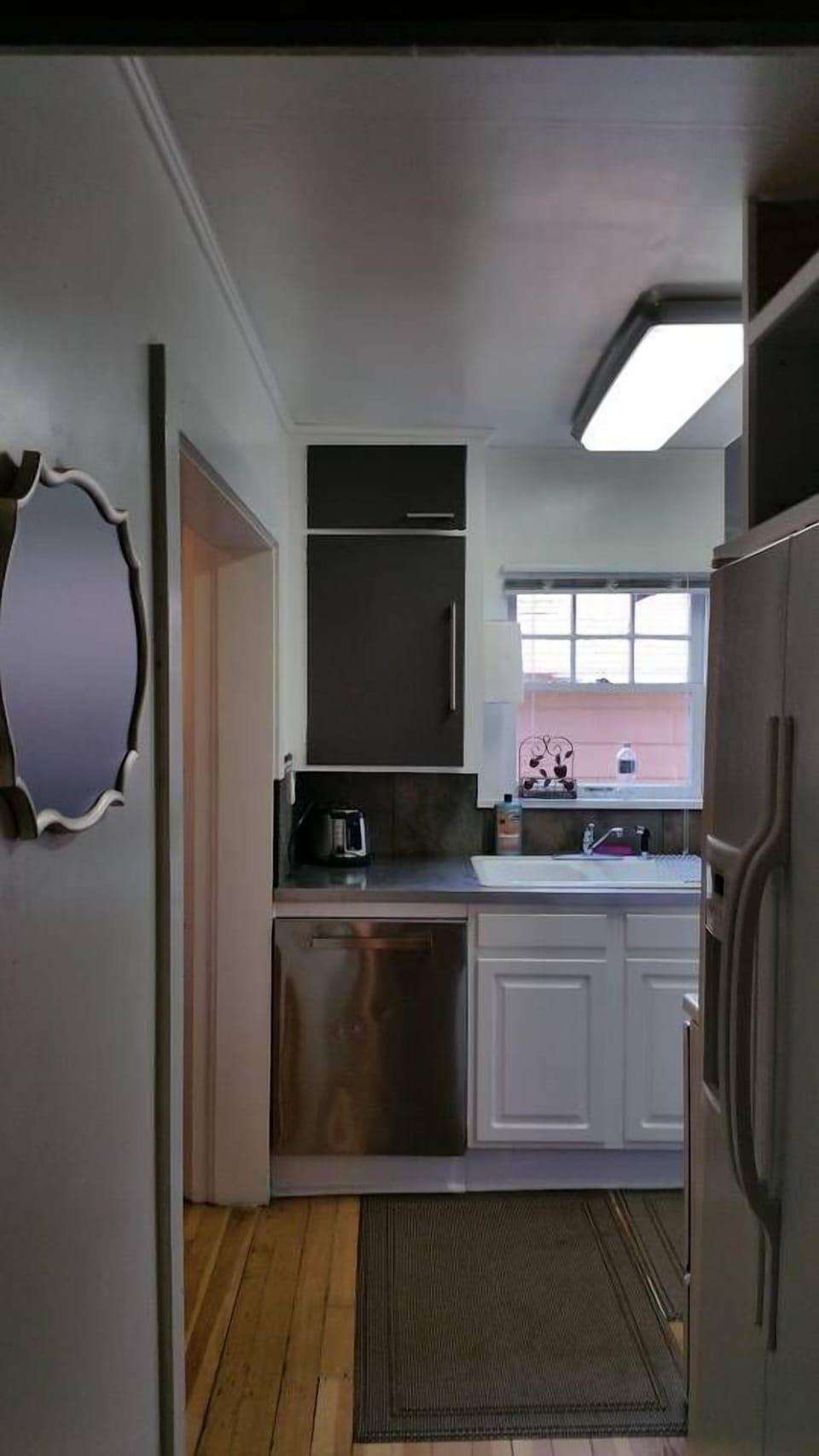 Kitchen has been remodeled and now includes stainless steel countertops, dishwasher plus microhood, range and side by side refrigerator!