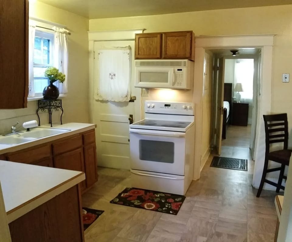 Self-Cleaning Oven, Microwave Plus Dishwasher. Fully Equipped kitchen includes Cookware & Bakeware + Dishes and Silverware. Microwave, wide mouth toaster and coffee machine just brought in for your convenience as well.
