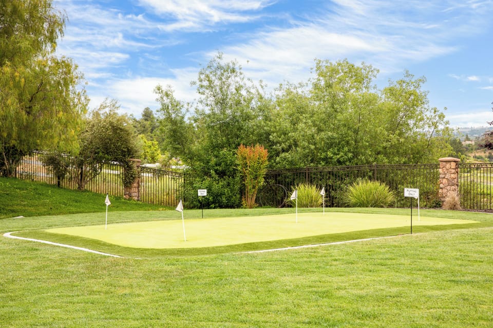 Private backyard putting green to practice your swing.