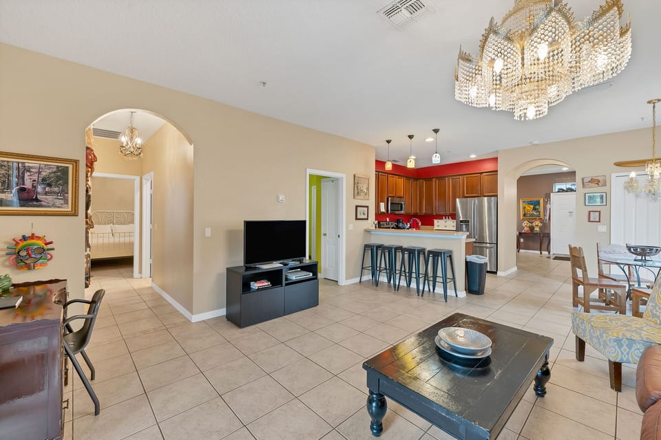 View of great room, kitchen, bedroom 2 and entrance. View door open laundry room
