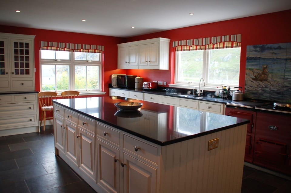 The well equipped kitchen with a 4 oven gas AGA, a gas hob and an electric oven.