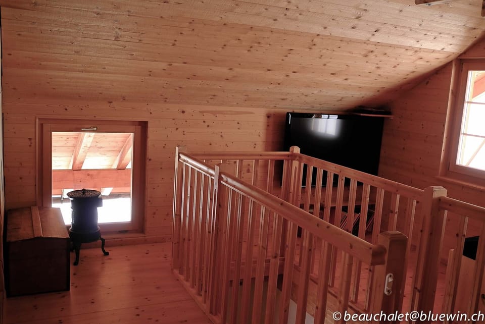 First floor, stairwell and TV corner.
