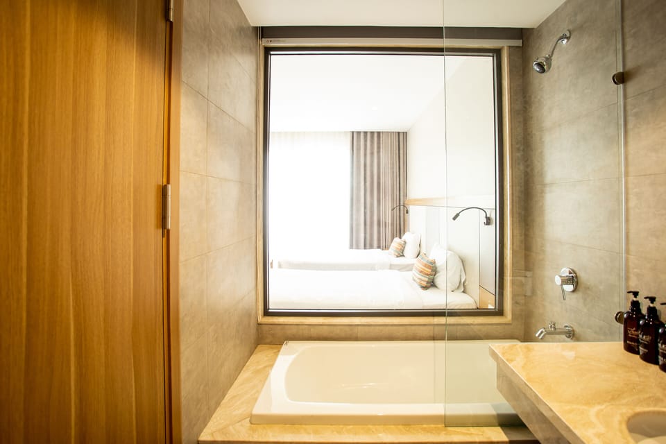Panoramic Double or Twin Room | Bathroom | Designer toiletries, hair dryer, slippers, towels
