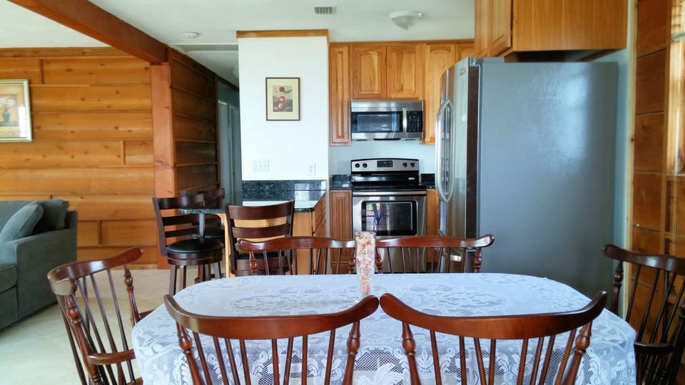 Kitchen with new stainless steel appliances , toaster oven, coffee maker, microw