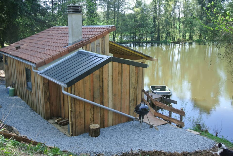 BBQ area and side of cabin