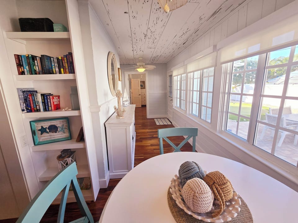 Loggia area off kitchen behind living room for additional dining & view of pool