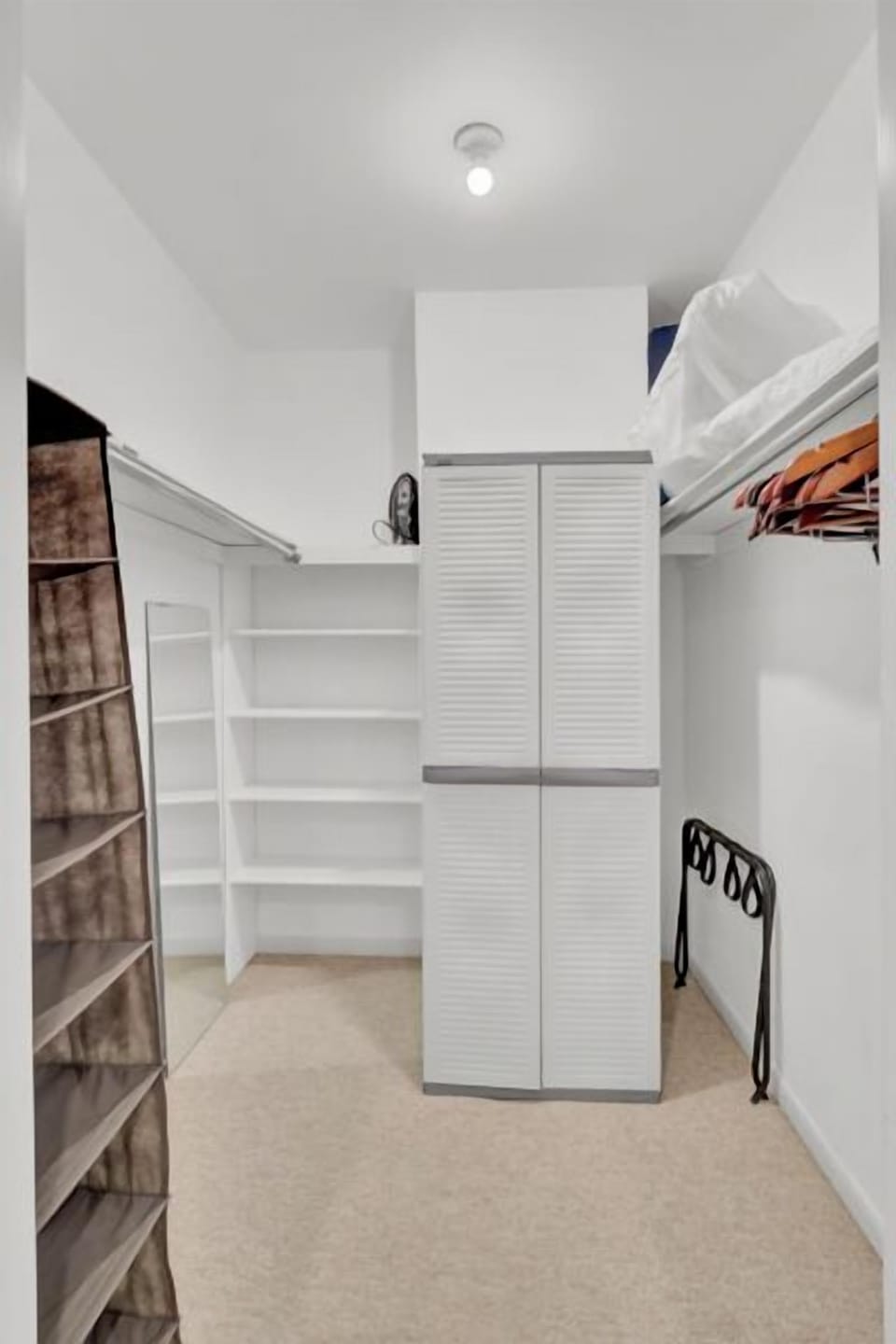 Step into your spacious walk-in closet with organized shelving and hanging space for all your belongings.