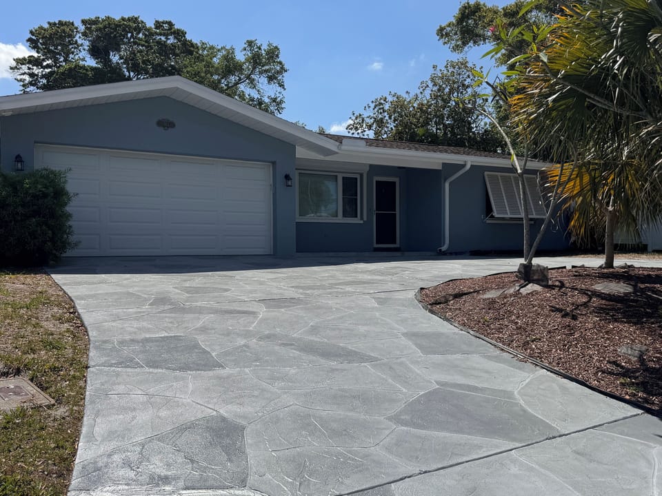 Front. Driveway is pitched uphill.