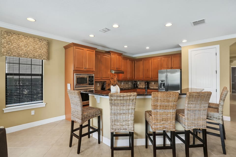 In addition to the dining table there is seating for 6 at the breakfast bar
