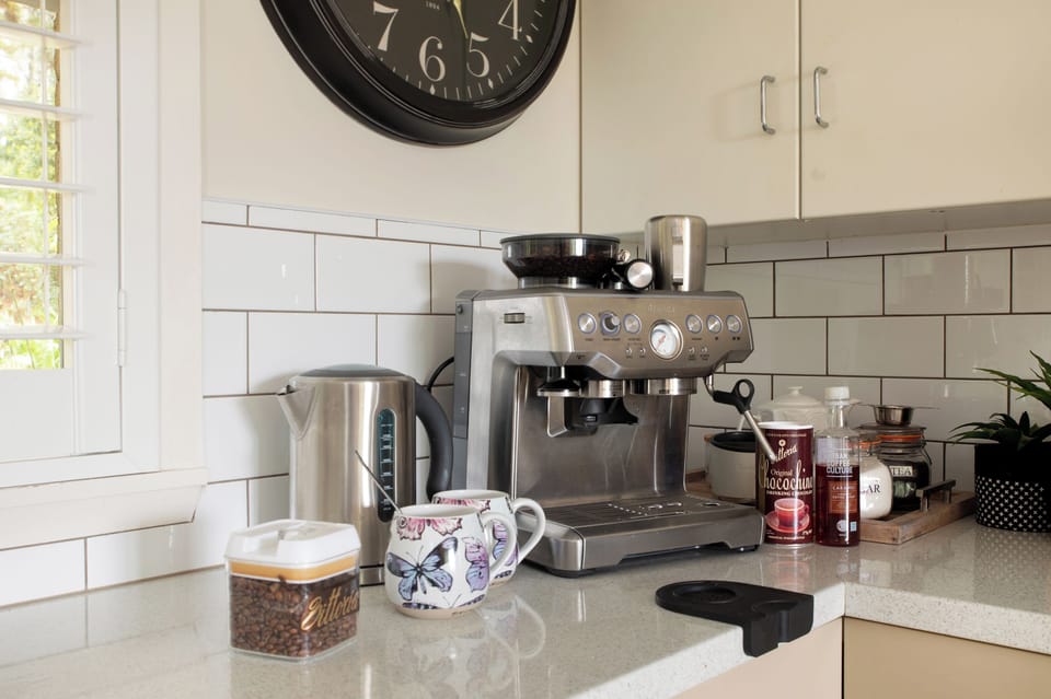 Breville expresso coffee machine, coffee beans, tea’s, hot chocolate.