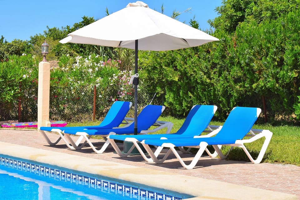 swimming pool in mallorca with sunbeds