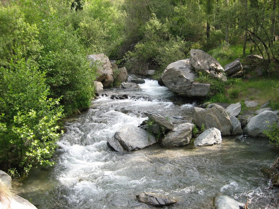 Rio Trevelez full of summer melt water from the high Sierra Nevada